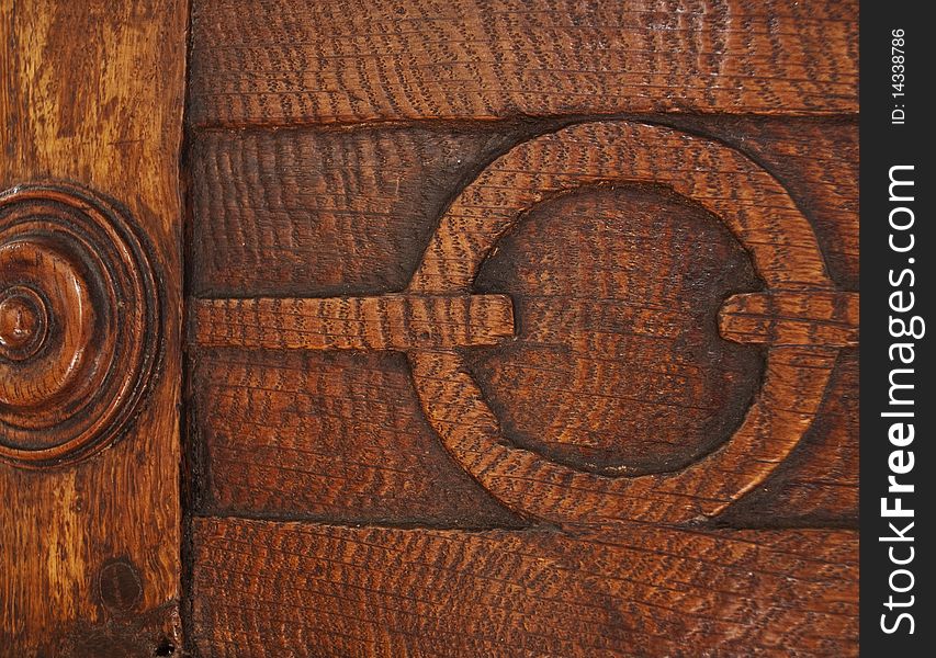 Detail from a curved wooden antique end table. Detail from a curved wooden antique end table.