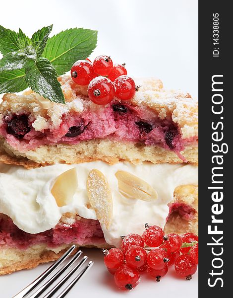 Red currant cake with crumb topping served with cream. Red currant cake with crumb topping served with cream