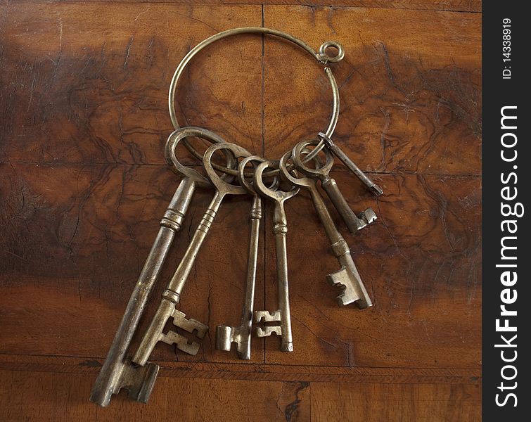 Antique skeleton keys with wood background. Antique skeleton keys with wood background.