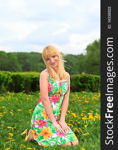 Woman sitting outdoors smiling