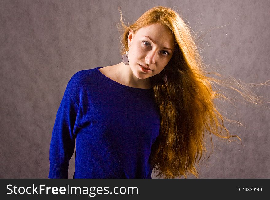 Young red-haired girl at studio