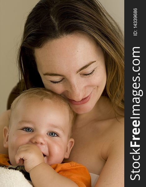 Baby and mother cuddling and laughing