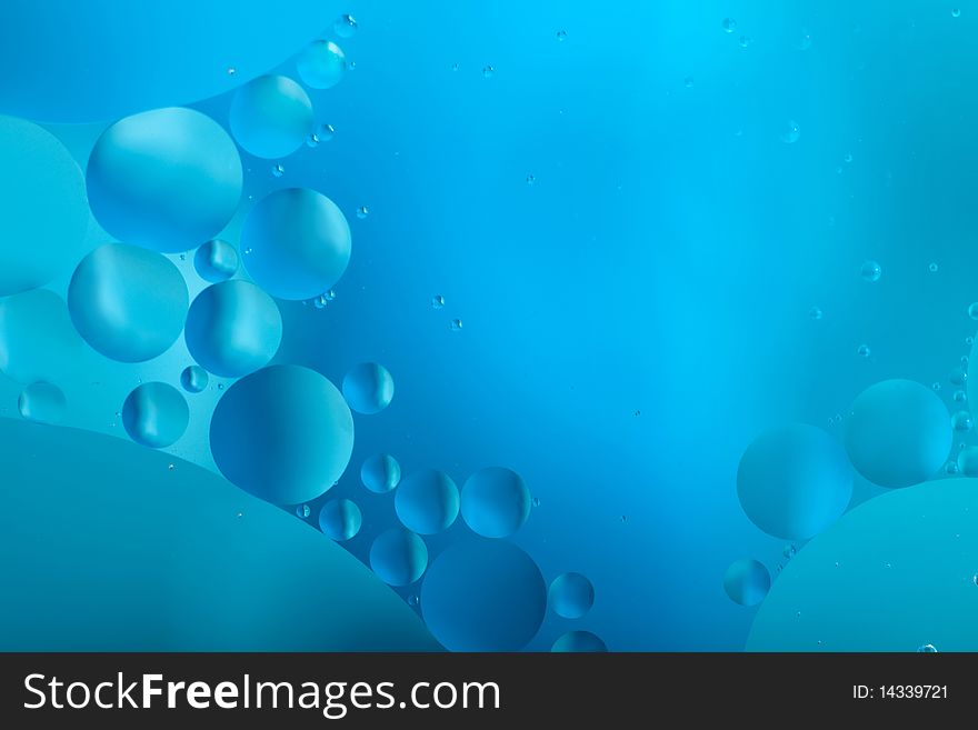 Oil in water with a blue background. Oil in water with a blue background