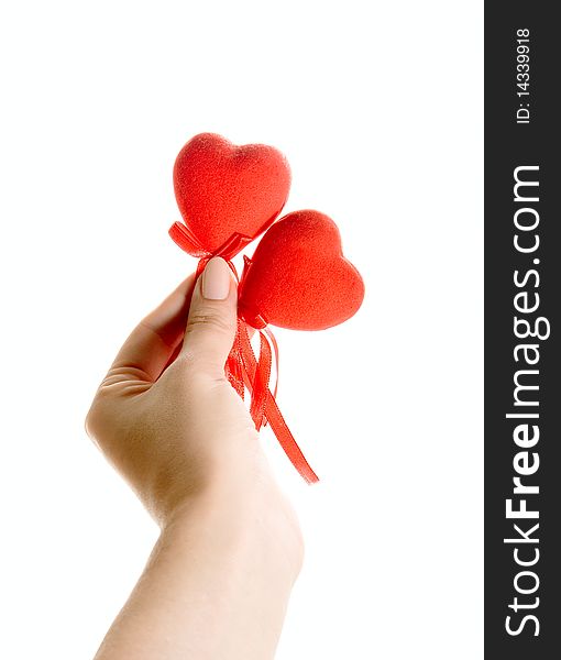 Red hearts in human hand isolated on white