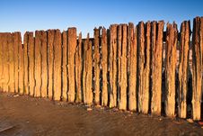 Poles In The Ocean At Sunset Stock Photos Poles In The Ocean At Sunset Stock Photos