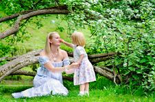 Mother And Daughter In Blooming Garden Royalty Free Stock Photos Mother And Daughter In Blooming Garden Royalty Free Stock Photos