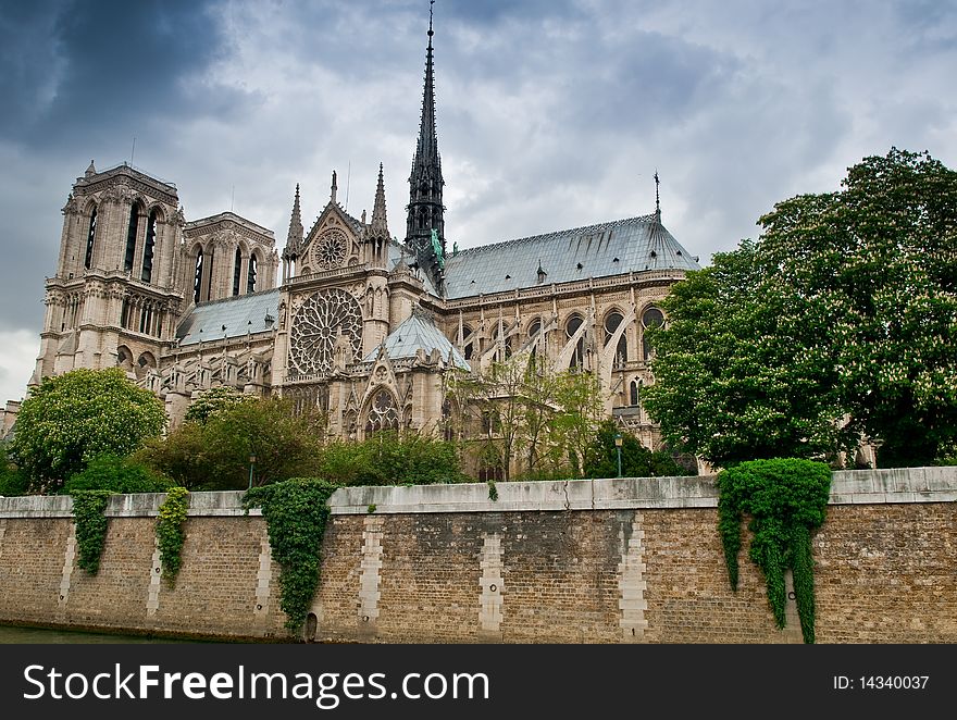 Notre Dame Cathedral in Paris, France against a stormy spring sky. Notre Dame Cathedral in Paris, France against a stormy spring sky.