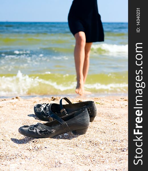 Shoes on sand at summer beach