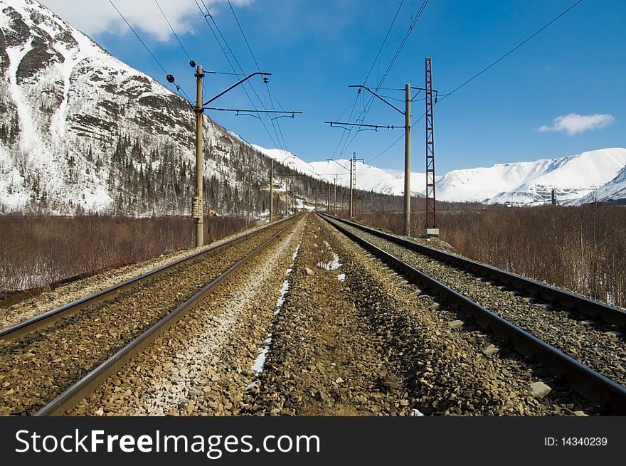 The railway leaving in snow-covered mountains. The railway leaving in snow-covered mountains