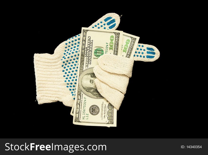 A glove with money isolated on black. A glove with money isolated on black