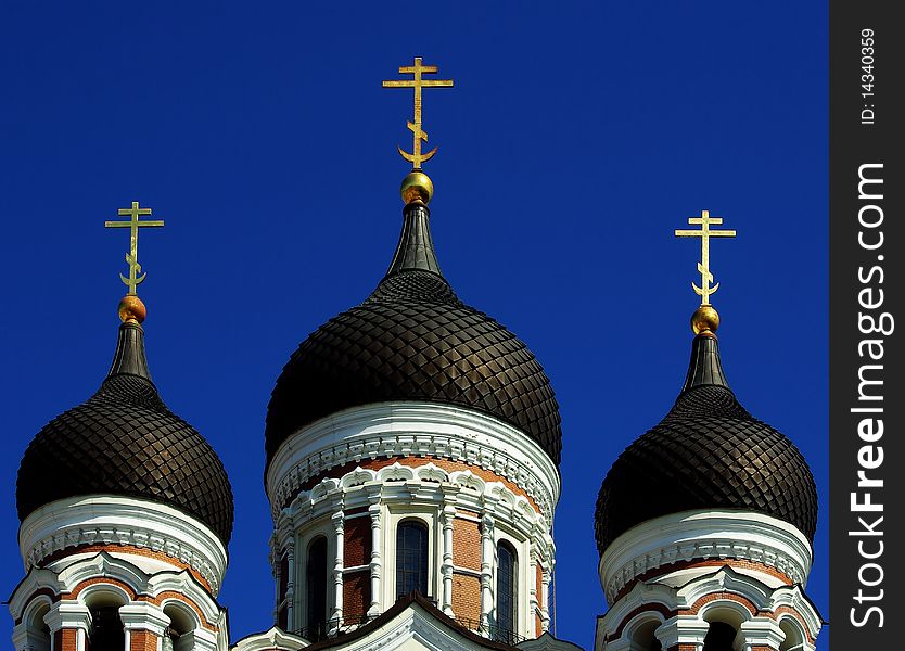 Domes of the Alexander Nevsky Cathedral in Tallinn, Estonia and clear blue sky.