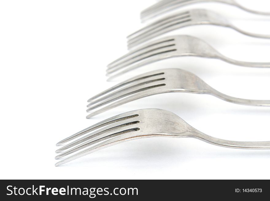 Group of Forks from the aged metal. Isolated on white