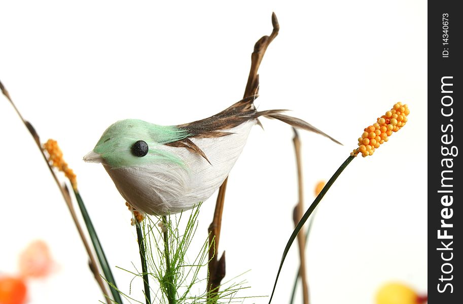 Decorative bird on branch on white background
