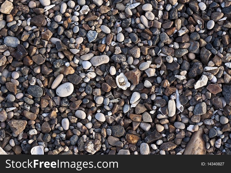 Various colored small river stones and shells