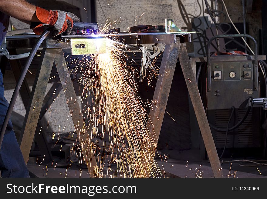 Sparks during working with steel in the factory. Sparks during working with steel in the factory