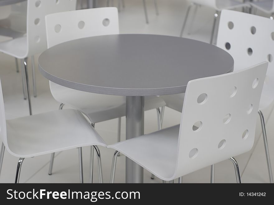 Grey chairs and table inside of office building