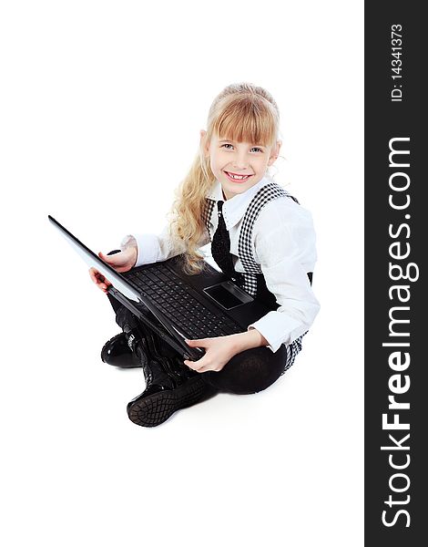 Shot of a little girl sitting on a floor with her laptop. Isolated over white background. Shot of a little girl sitting on a floor with her laptop. Isolated over white background.