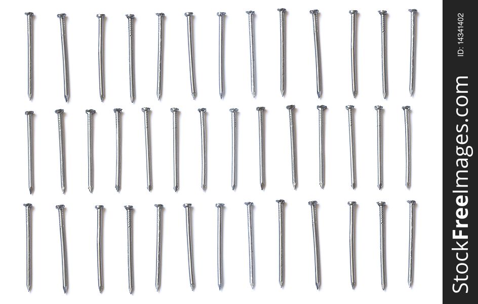 Three Rows Of Steel Nails Isolated On White