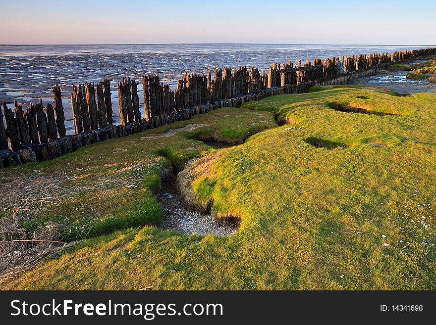 Poles in the ocean at a beautiful sunset. Poles in the ocean at a beautiful sunset