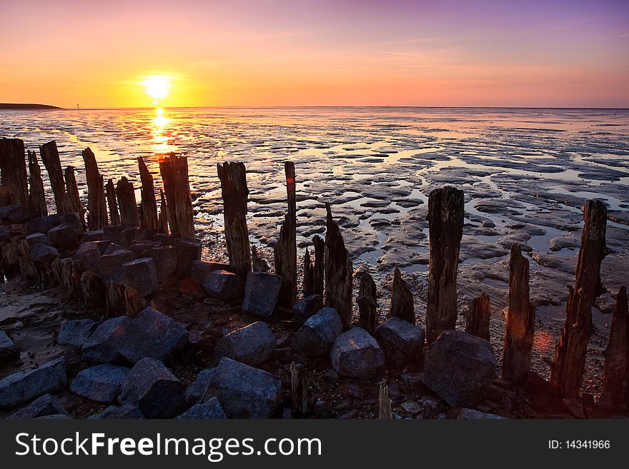 Poles in the ocean at a beautiful sunset. Poles in the ocean at a beautiful sunset