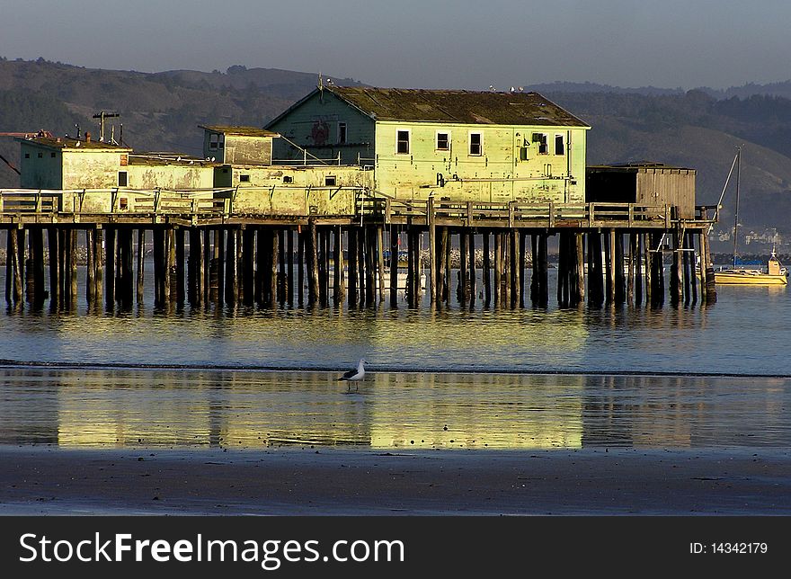 Picture represents an abandoned old wooden house at the shore. Picture represents an abandoned old wooden house at the shore