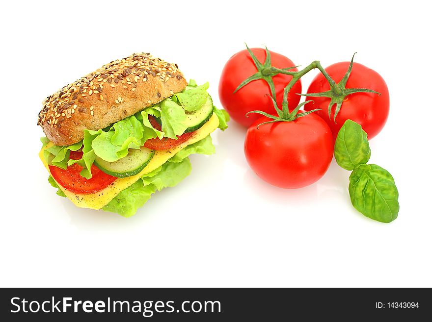 Fresh sandwich with cheese and vegetables isolated on white