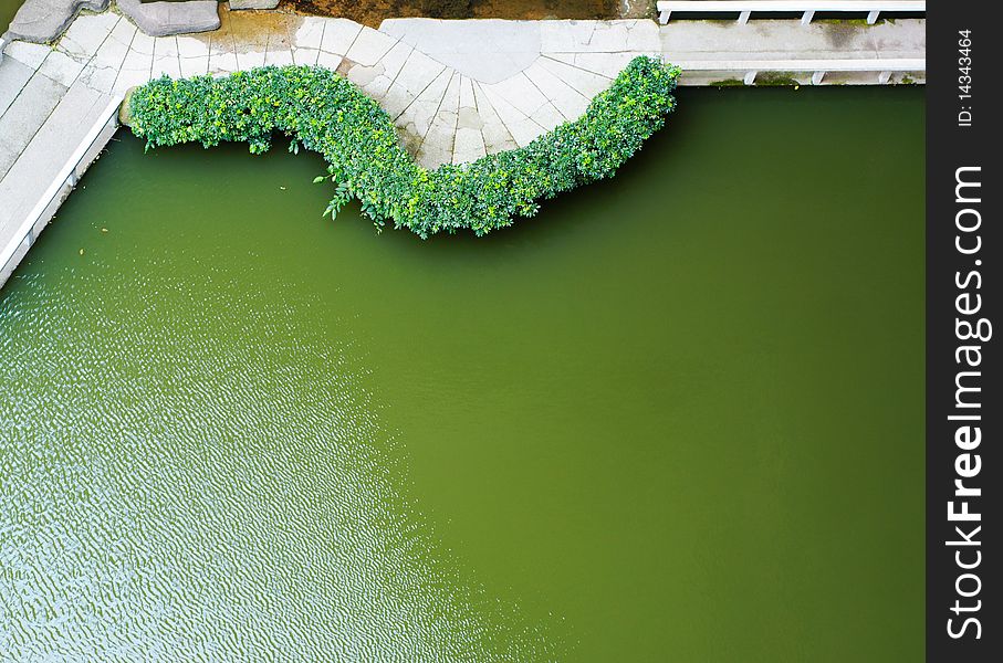 This image is of a walk area in a stone quarry and lake area. This image is of a walk area in a stone quarry and lake area.