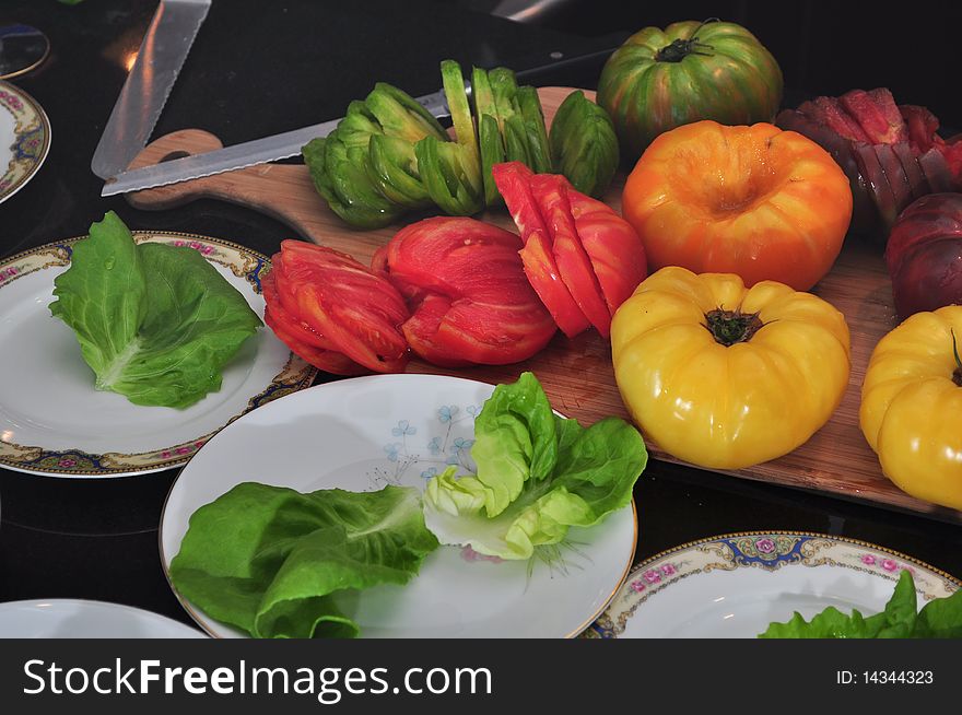 Selection of Heirloom Tomatoes being prepped for a Salad. Selection of Heirloom Tomatoes being prepped for a Salad