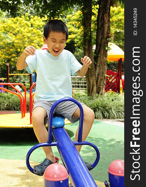 A child playing on playground. A child playing on playground.