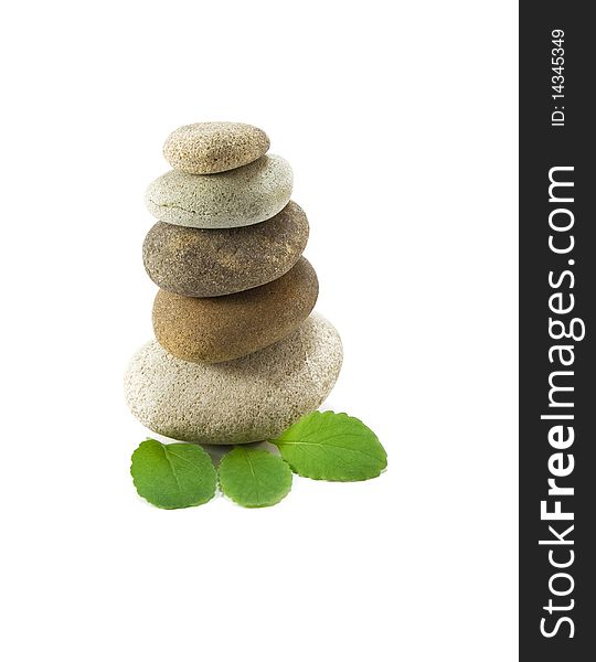 Stack of pebbles and leaf on white background. Stack of pebbles and leaf on white background
