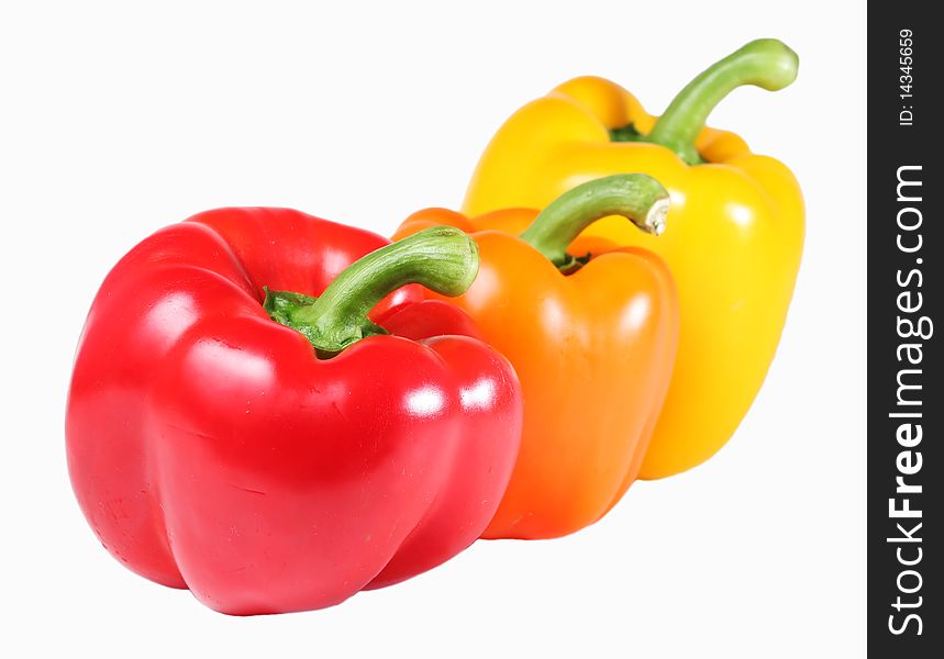 Orange, Red, and Yellow Bell Peppers, isolated on a white background. Orange, Red, and Yellow Bell Peppers, isolated on a white background