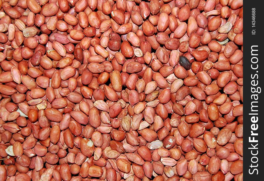 Red grain peanut on the entire background (texture)