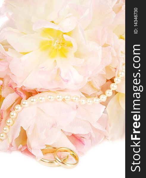 Wedding rings and pink tulips with pearl on white (wedding invitation card ).