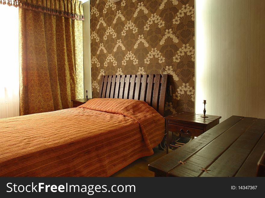 Interior of a bedroom with big bed