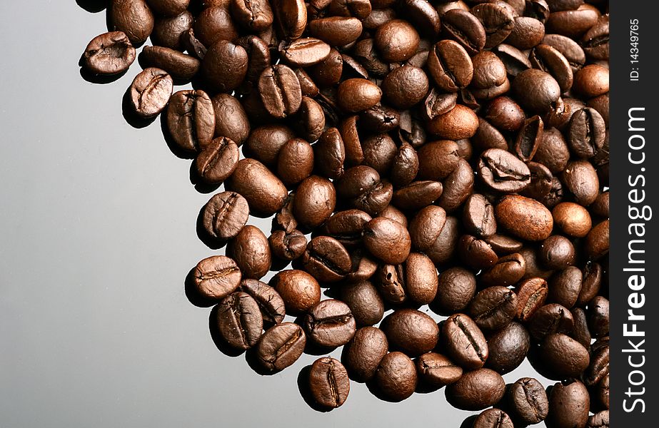 Coffee beans on mirror background. Coffee beans on mirror background