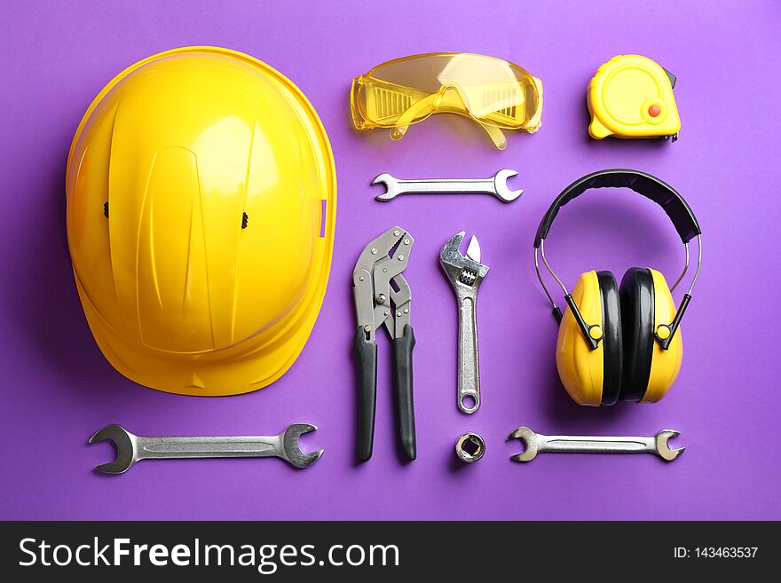 Flat lay composition with different construction tools on color background