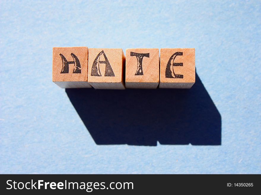 Word hate in wooden block letters