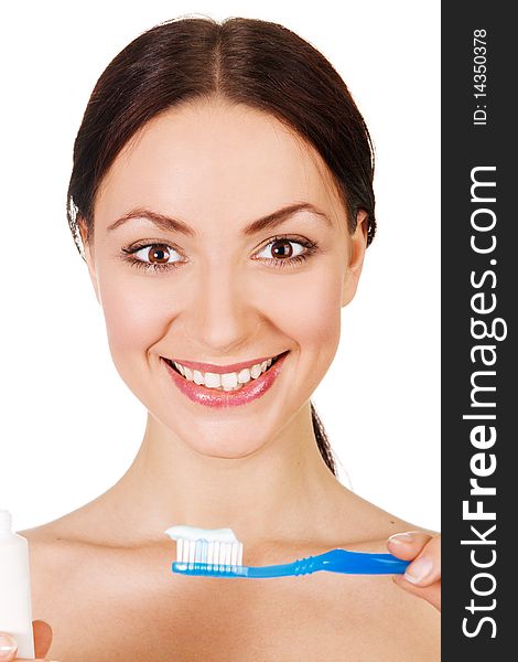Beautiful young woman holding toothpaste and toothbrush, white background. Beautiful young woman holding toothpaste and toothbrush, white background