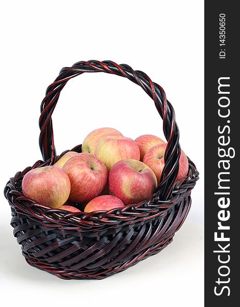 A basket with red ripe apples