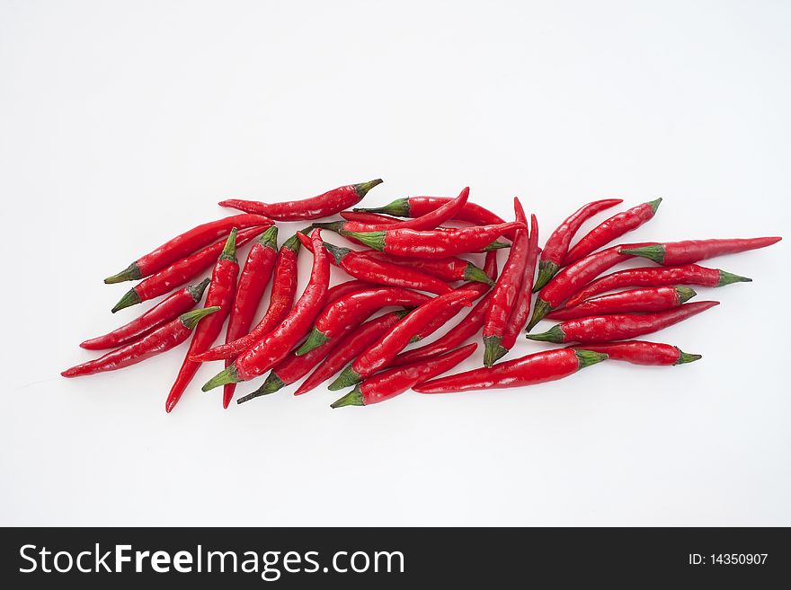 Composition of red chili pepper isolated on white background