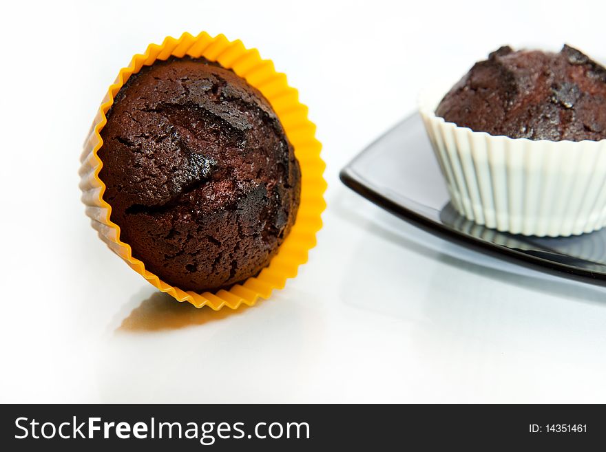 Tow chocolate muffins isolated on white background. Tow chocolate muffins isolated on white background