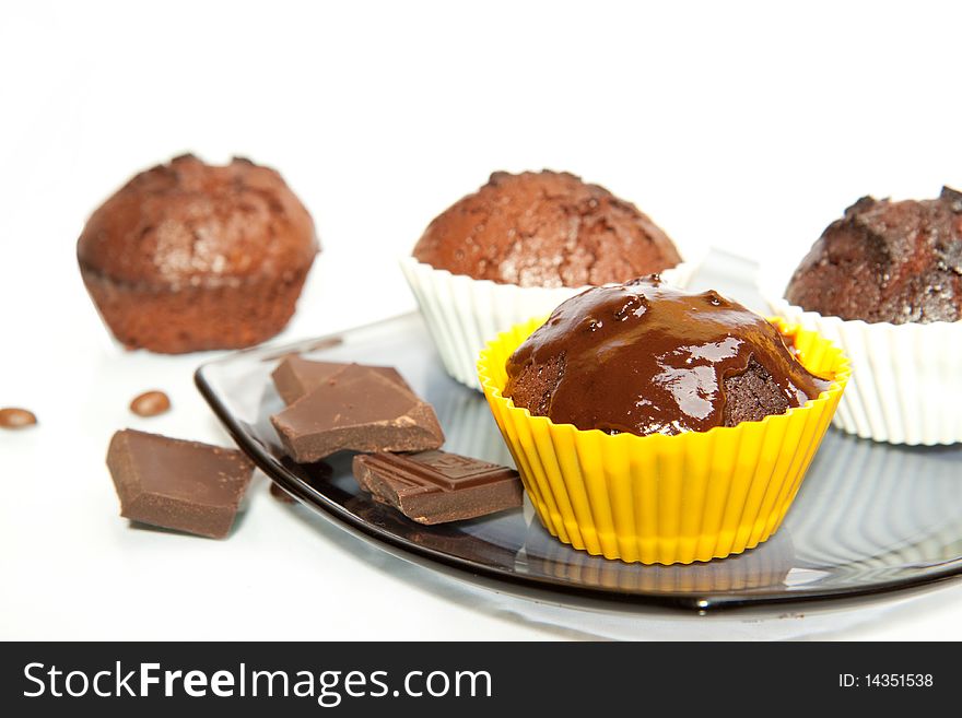 Chocolate muffins with coffee beans and chocolate