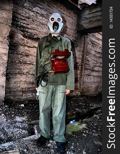 Teenager weared American military uniform.Lost city. Near Chernobyl area. Modern ruins. Ukraine. Kiev region. Teenager weared American military uniform.Lost city. Near Chernobyl area. Modern ruins. Ukraine. Kiev region