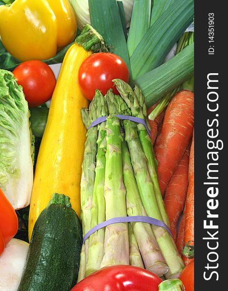 Many fresh, different types of vegetables stacked in a pile