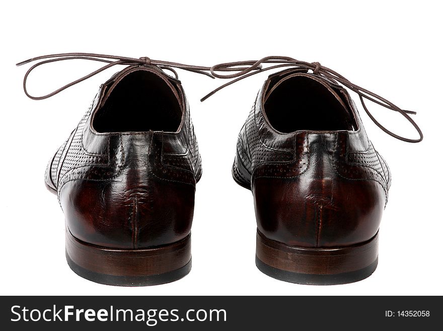 Black female shoes on a high heel. It is isolated on a white background