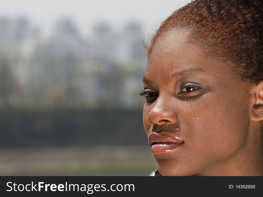 Head shot of an African-American woman outdoors. Head shot of an African-American woman outdoors