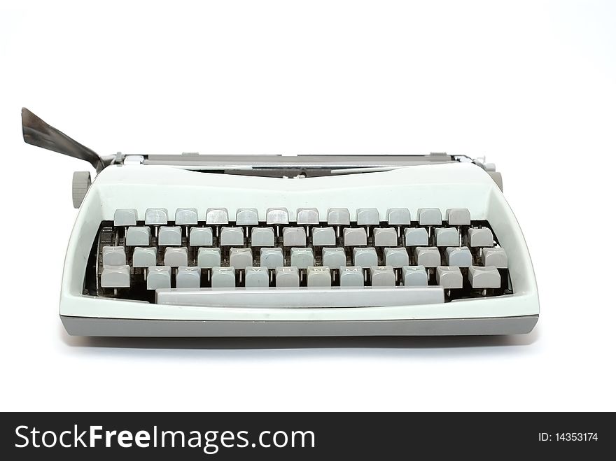 Very old typewriter seen the girl who is isolated on a white background. Very old typewriter seen the girl who is isolated on a white background