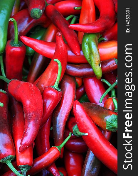 Photo of green and red peppers saling on the market