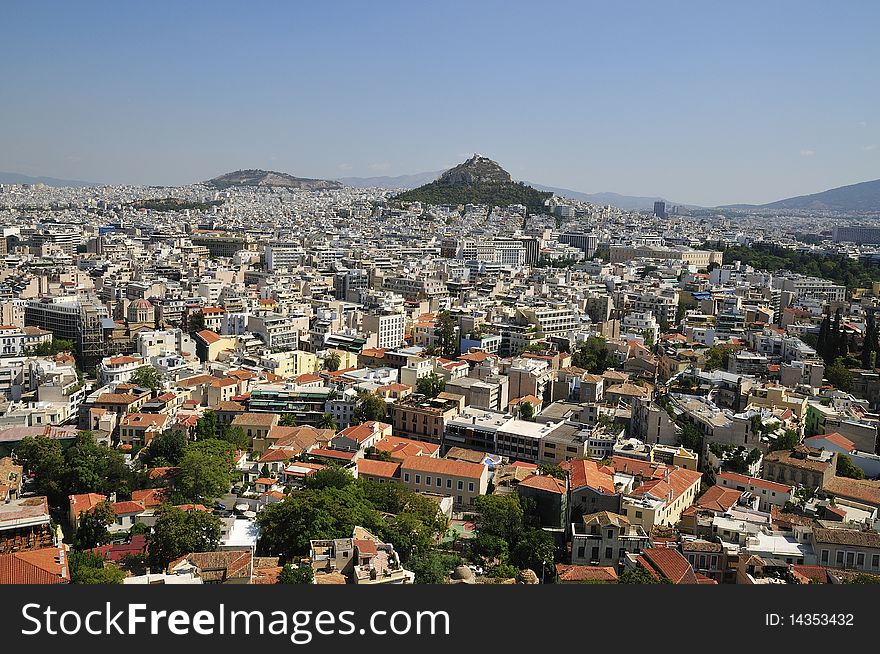 Overall view on Athens with tops Acropolis