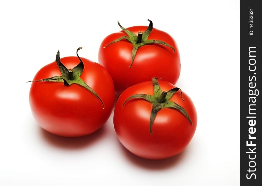 Three tomatoes isolated on white background. Three tomatoes isolated on white background